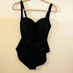 Immerse black one peice bathing suit.  Size 8.‎ Flattering roughing. No wire.